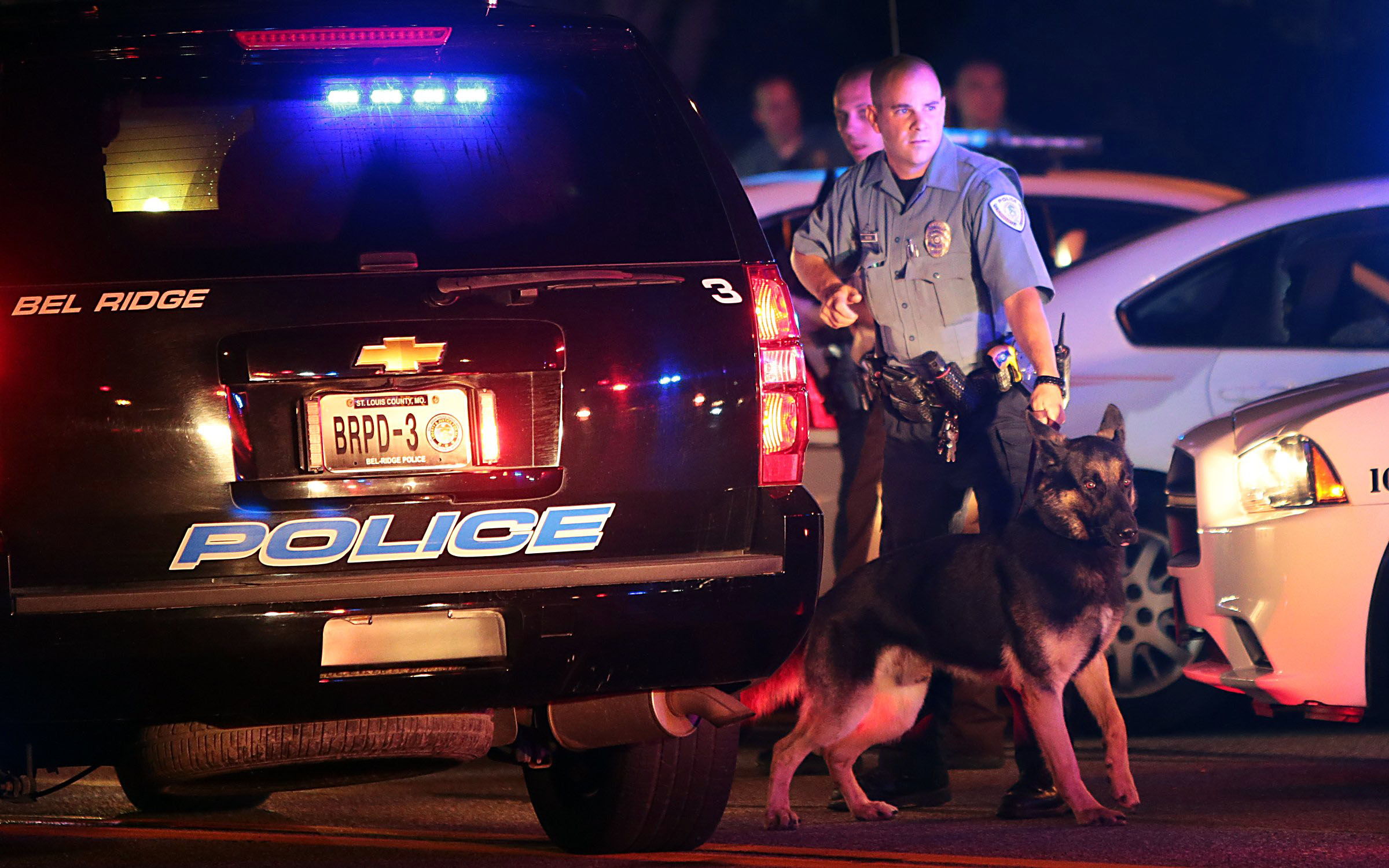 PHOTO: Police officers patrol in Ferguson, Mo., Aug. 10, 2014, following protests after a vigil for Michael Brown, 18.