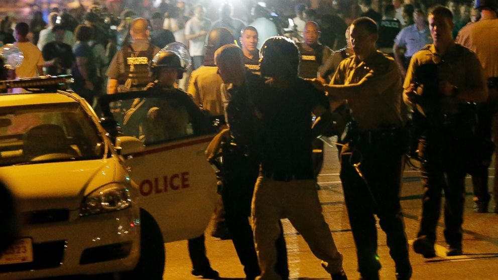 PHOTO: Police detain a protester, Aug. 18, 2014, during a protest for Michael Brown, who was killed by a police officer Aug. 9 in Ferguson, Mo.