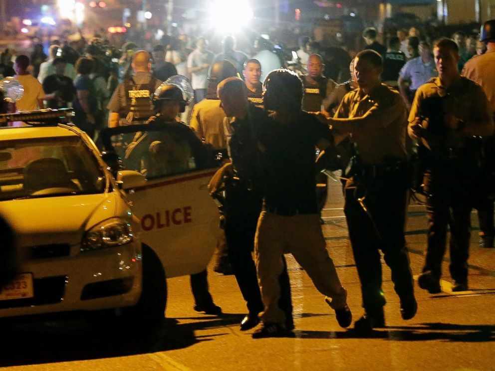 PHOTO: Police detain a protester, Aug. 18, 2014, during a protest for Michael Brown, who was killed by a police officer Aug. 9 in Ferguson, Mo.