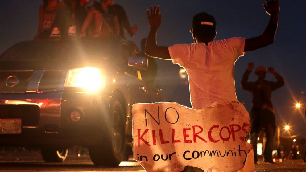 PHOTO: People protest against the shooting death of Michael Brown, Aug. 17, 2014 in Ferguson, Mo.