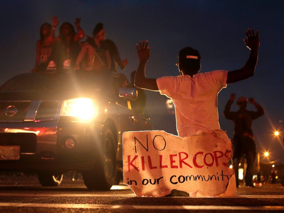 PHOTO: People protest against the shooting death of Michael Brown, Aug. 17, 2014 in Ferguson, Mo.