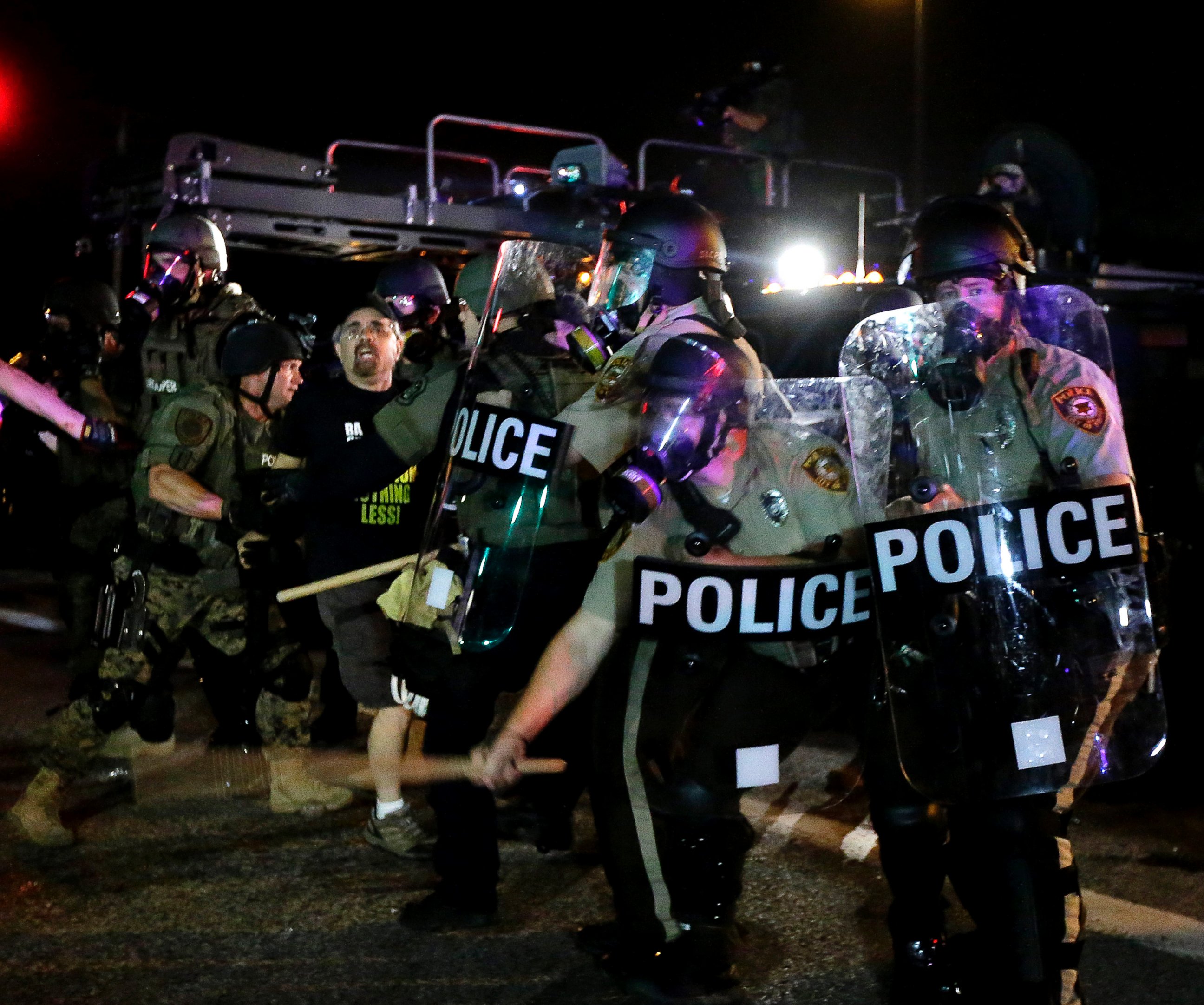 PHOTO: A man is detained after a standoff with police, Aug. 18, 2014, in Ferguson, Mo.