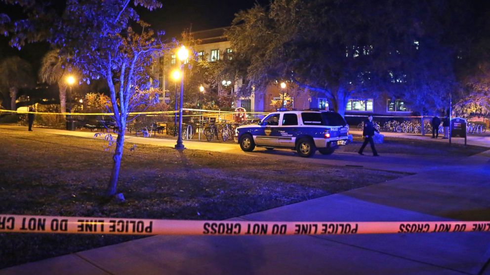 Police investigate a shooting at Strozier Library on Florida State University's campus, Nov. 20, 2014, in Tallahassee, Fla.