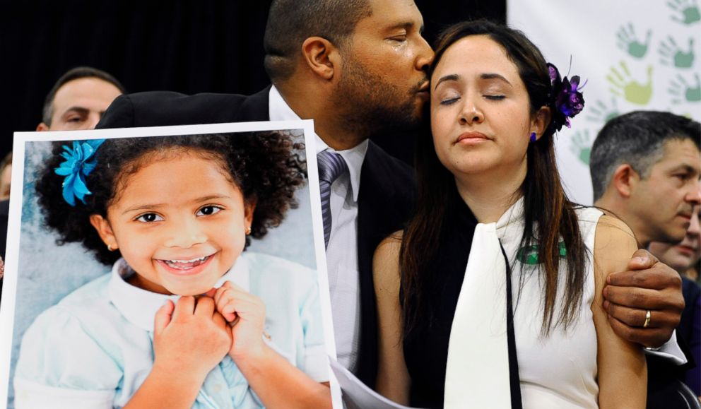 PHOTO: Jimmy Greene kisses his wife Nelba Marquez-Greene as he holds a portrait of their daughter, Sandy Hook School shooting victim Ana Marquez-Greene at a news conference at Edmond Town Hall in Newtown, Conn., Jan. 14, 2013.