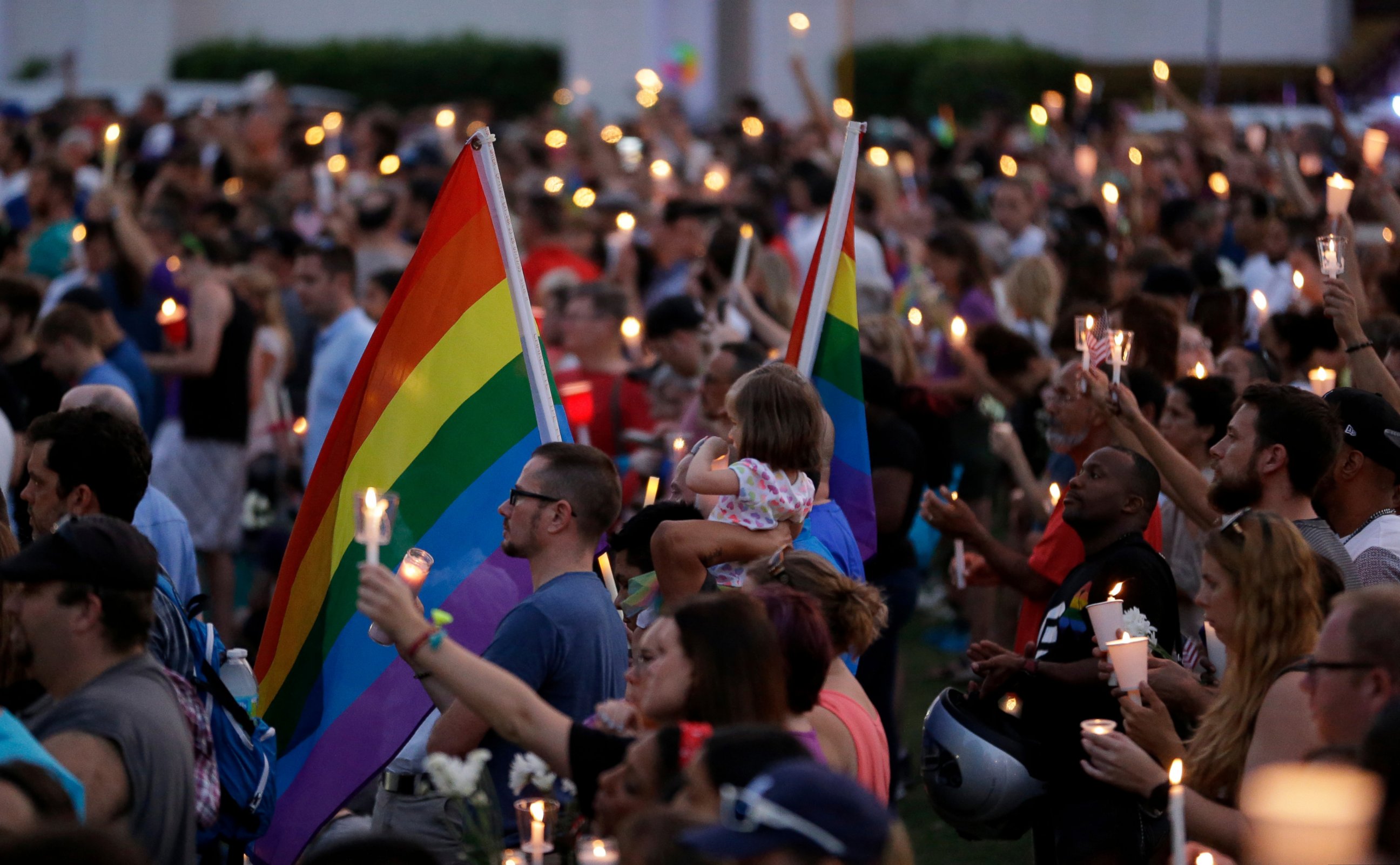 PHOTO: Supporters of the victims of the recent mass shooting at the Pulse nightclub attend a vigil at Lake Eola Park, June 19, 2016, Orlando, Florida. Tens of thousands of people attended the vigil. 