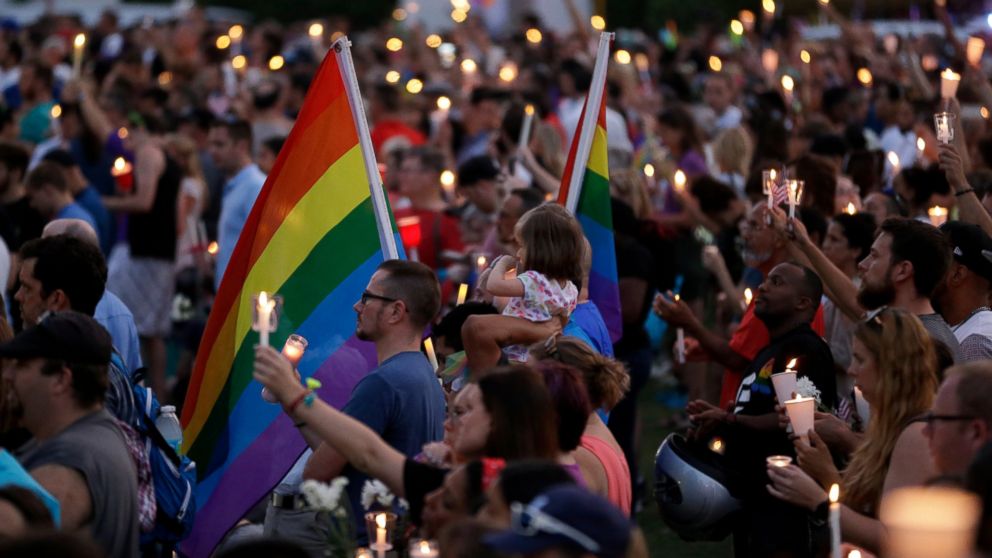 PHOTO: Supporters of the victims of the recent mass shooting at the Pulse nightclub attend a vigil at Lake Eola Park, June 19, 2016, Orlando, Florida. Tens of thousands of people attended the vigil. 