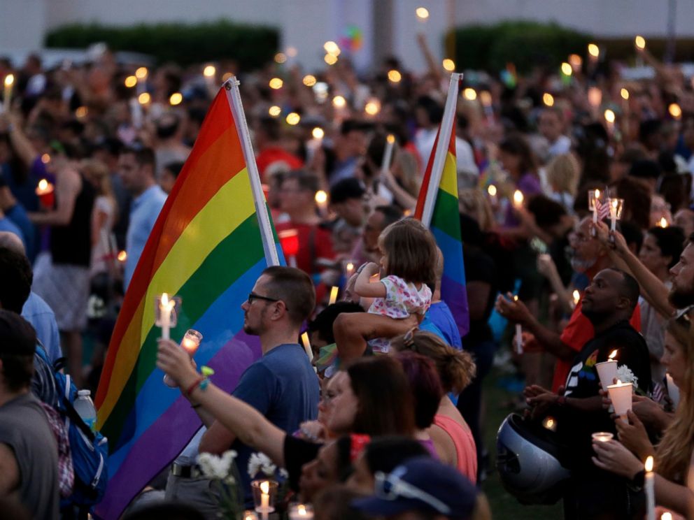 PHOTO: Supporters of the victims of the recent mass shooting at the Pulse nightclub attend a vigil at Lake Eola Park, June 19, 2016, Orlando, Florida. Tens of thousands of people attended the vigil.