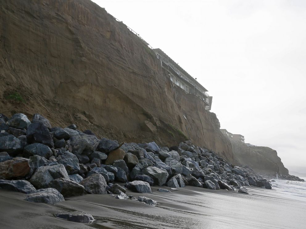 PHOTO: Boulders shore up an eroding cliff below an apartment complex, Jan. 25, 2016, in Pacifica, Calif. Strong waves caused by El Nino storms ate away part of a sea wall and cliffs threatening several homes and an apartment building.