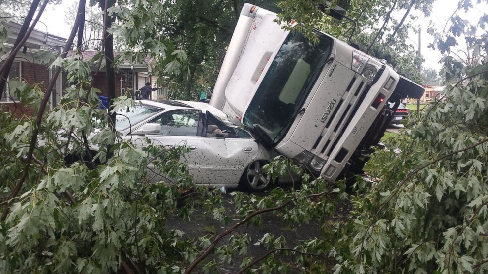 PHOTO: A vehicle rests on another after a tornado struck in Kokomo, Indiana, Aug. 24, 2016. 