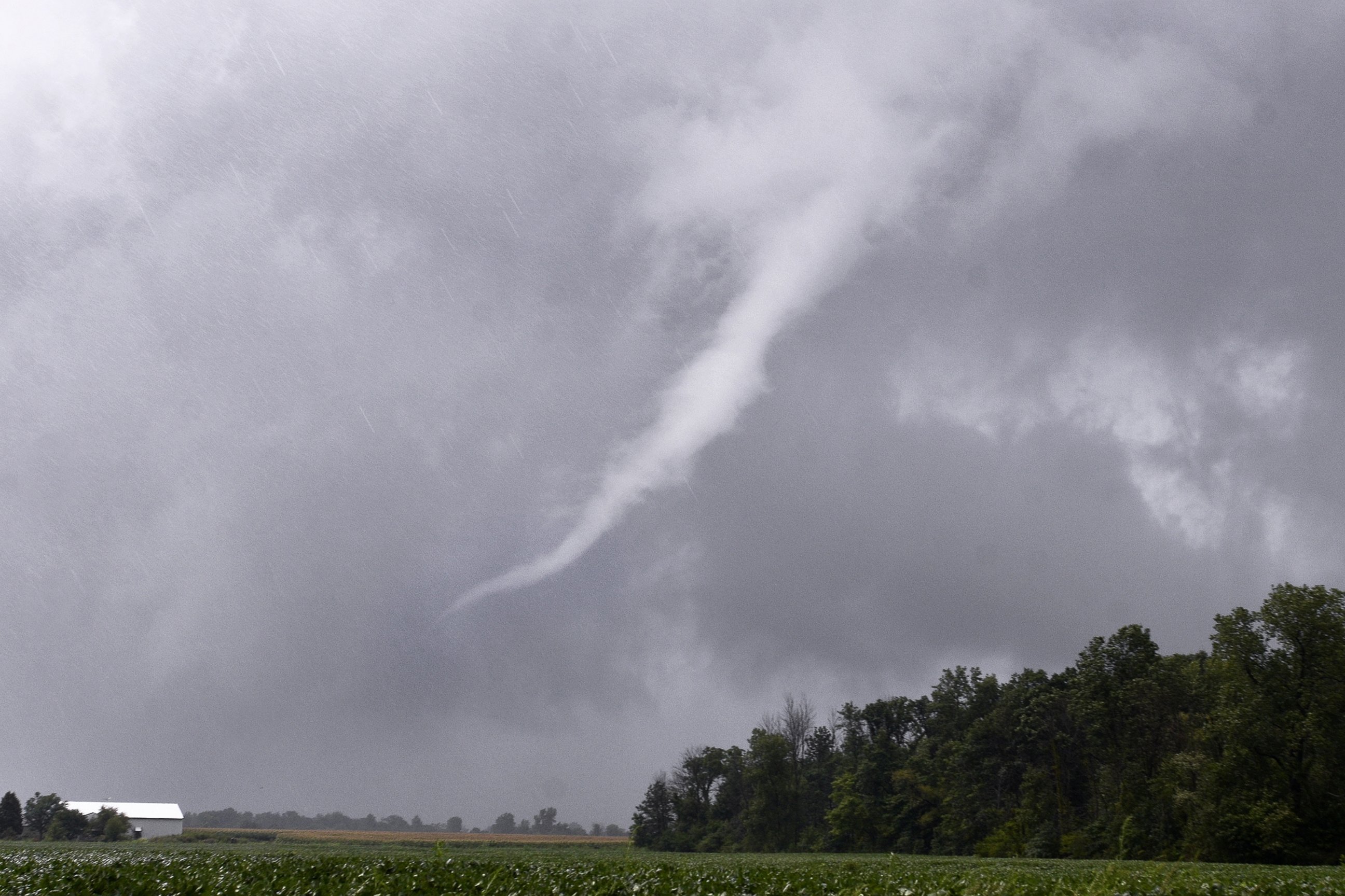 PHOTO: A funnel cloud near Van Buren, Indiana, moves east before breaking up as storms move through Grant County, Aug. 24, 2016. 