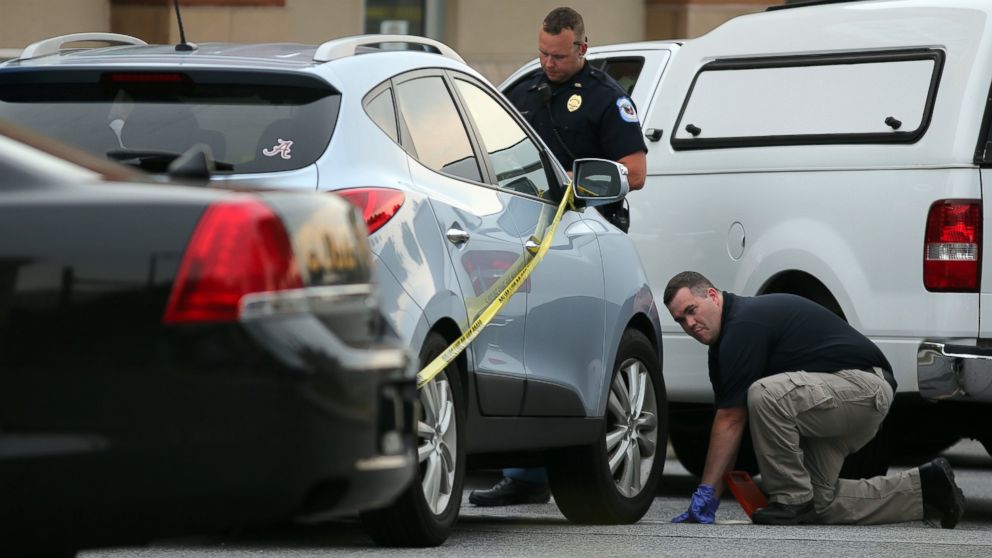 Police investigate the SUV where a toddler died in 2014 when the father forgot to drop his child off at day care and went to work. 


