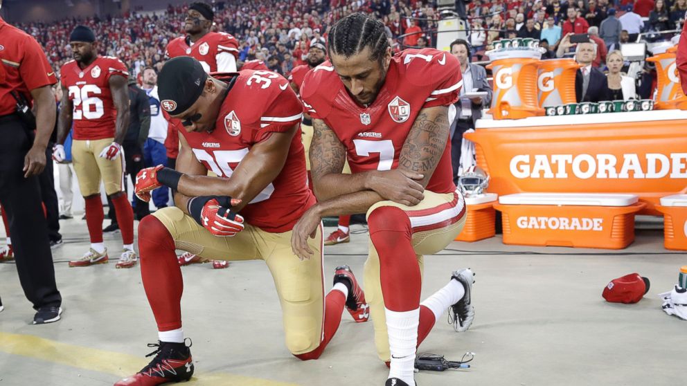 San Francisco 49ers safety Eric Reid (35) and quarterback Colin Kaepernick (7) kneel during the national anthem before an NFL football game against the Los Angeles Rams in Santa Clara, Calif., Monday, Sept. 12, 2016. 