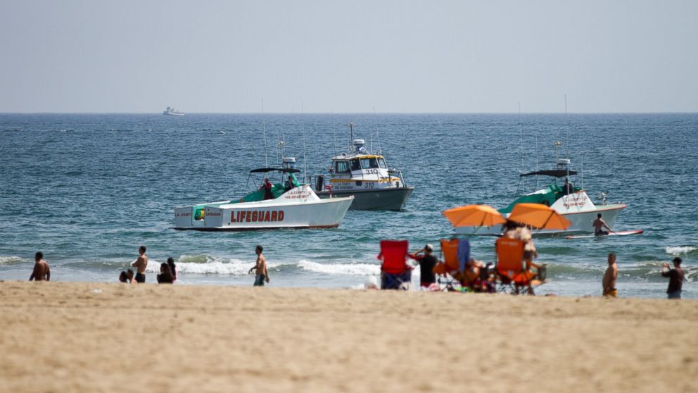 PHOTO: Lifeguard rescue boats patrol off the shore at Venice Beach, July 27, 2014 in Los Angeles, following a lightning strike.