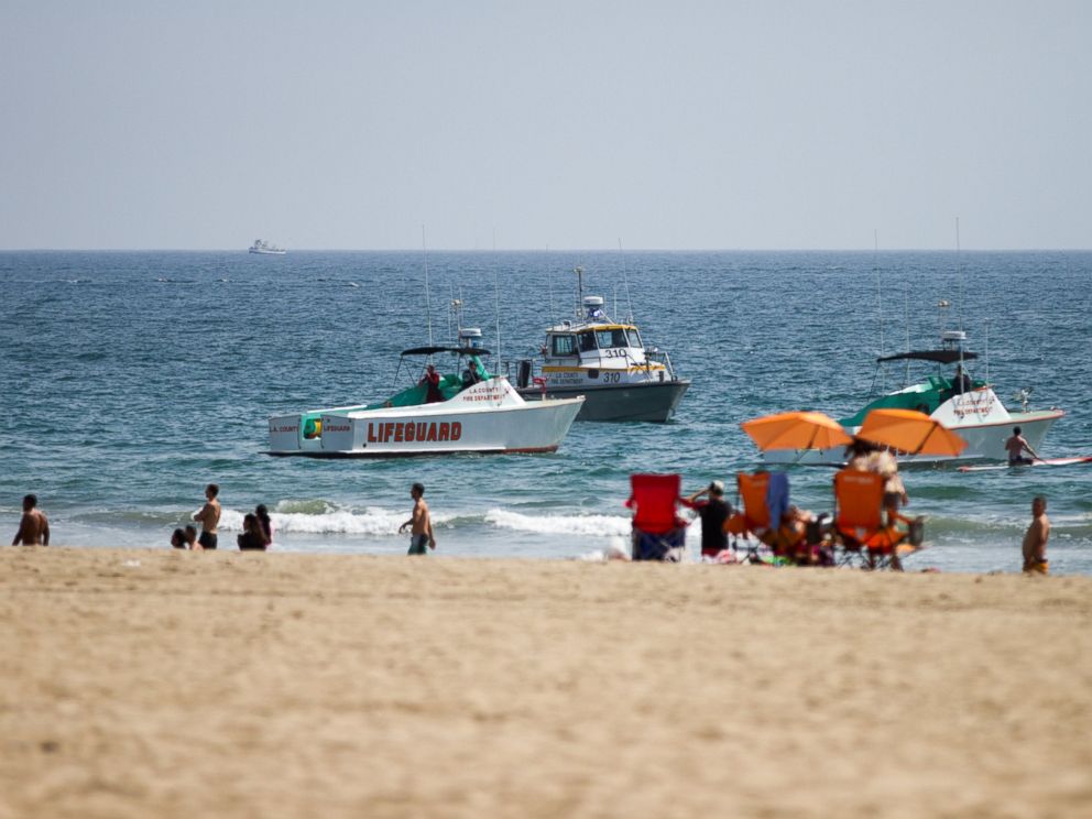 PHOTO: Lifeguard rescue boats patrol off the shore at Venice Beach, July 27, 2014 in Los Angeles, following a lightning strike.