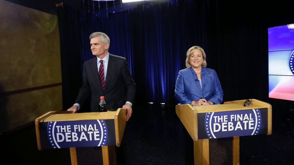 Sen. Mary Landrieu, D-La., and Rep. Bill Cassidy, R-La., wait for the start of their final debate for the Senate election runoff in Baton Rouge, La., Dec. 1, 2014.