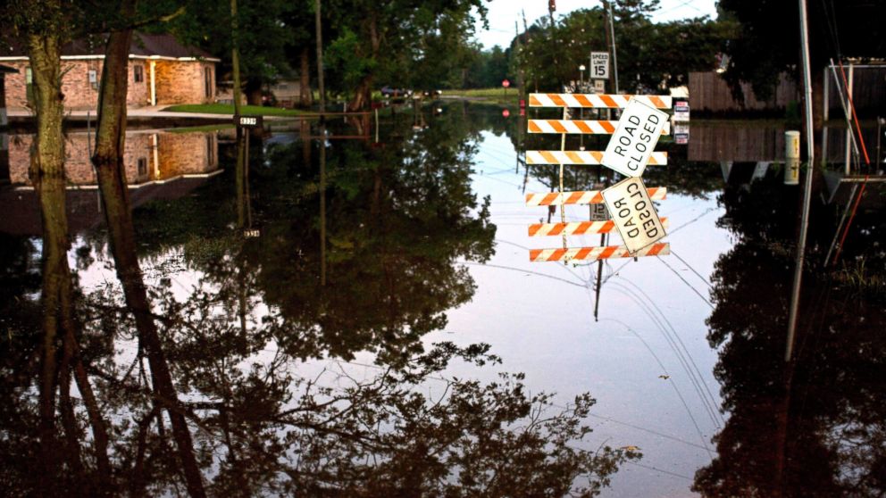 PHOTO: Standing water closes roads, Aug. 20, 2016, in Sorrento, Louisiana.