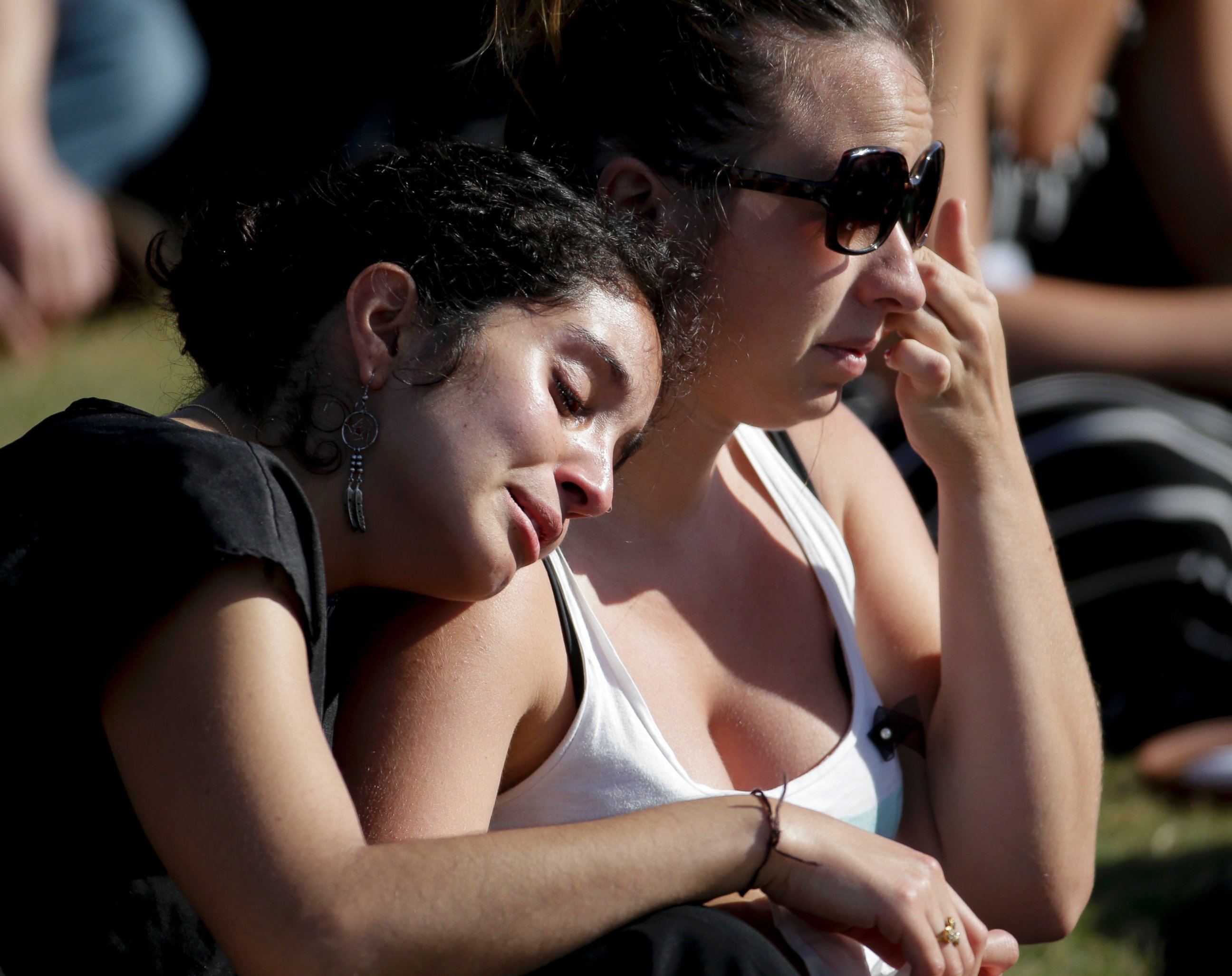 PHOTO: Students cry during a memorial service for the victims and families of Friday's rampage at Harder Stadium on the campus of University of California, Santa Barbara, May 27, 2014.