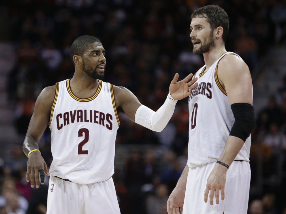 PHOTO: Cleveland Cavaliers' Kyrie Irving, left, talks with Kevin Love during an NBA basketball game against the Miami Heat, Feb. 11, 2015, in Cleveland. 