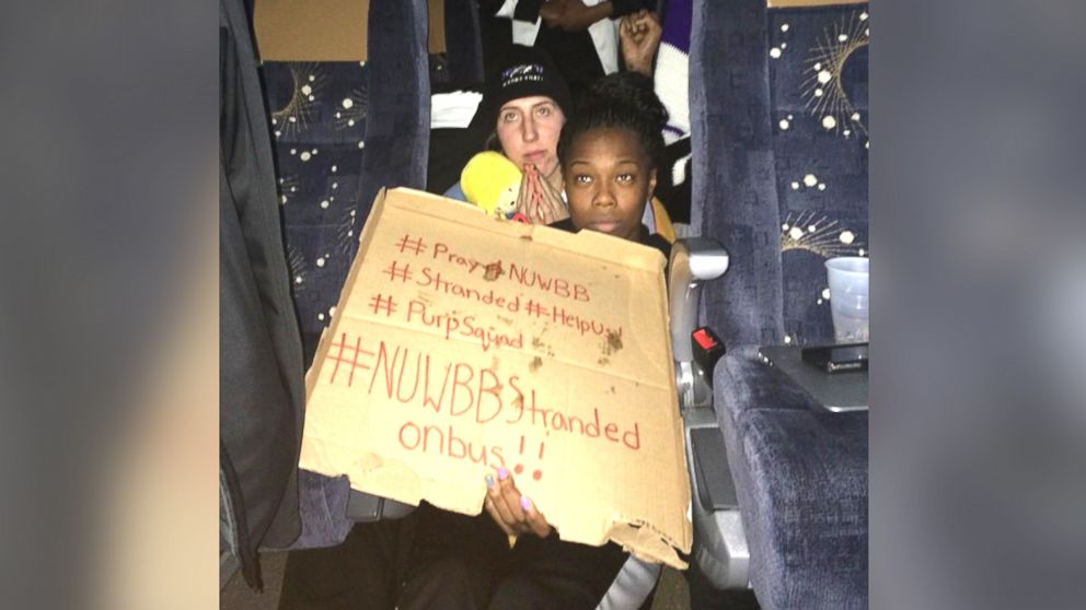 PHOTO: This photo provided by Chelsea Andorka, the Niagara University women’s basketball team spokeswoman, shows the team holding a sign while their bus was snowbound near Lackawanna, N.Y., Nov. 18, 2014.
