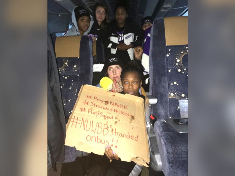 PHOTO: This photo provided by Chelsea Andorka, the Niagara University women’s basketball team spokeswoman, shows the team holding a sign while their bus was snowbound near Lackawanna, N.Y., Nov. 18, 2014.