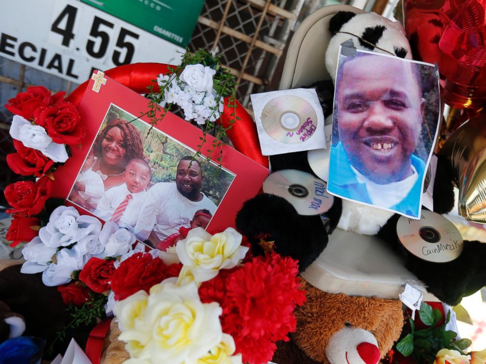 PHOTO: Photos of Alton Sterling are interspersed with flowers and mementos at a makeshift memorial in front of the Triple S Food Mart in Baton Rouge, Louisiana, July 7, 2016.