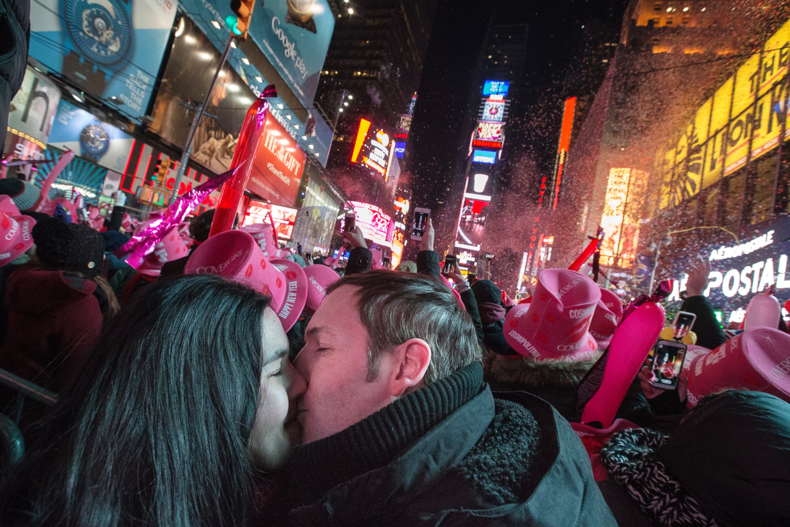 Chris and Chelsea Crawford, of Scotland, share a kiss at midnight in Times Square during a New Year's Eve celebration, Thursday, Jan. 1, 2015, in New York. Thousands braved the cold to watch the annual ball drop and ring in the new year.
