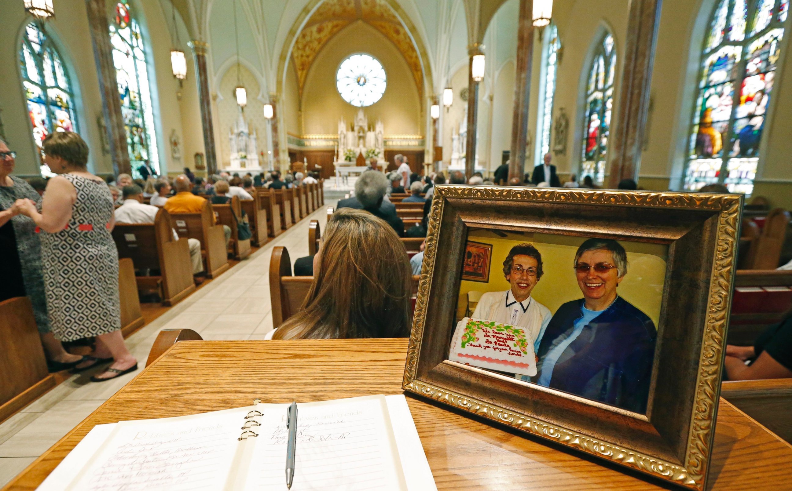 PHOTO: A photograph of Sister Margaret Held of the School Sisters of St. Francis, left, and Sister Paula Merrill, of the Sisters of Charity of Nazareth, is placed at the Cathedral of St. Peter the Apostle, Aug. 29, 2016 in Jackson, Mississippi.