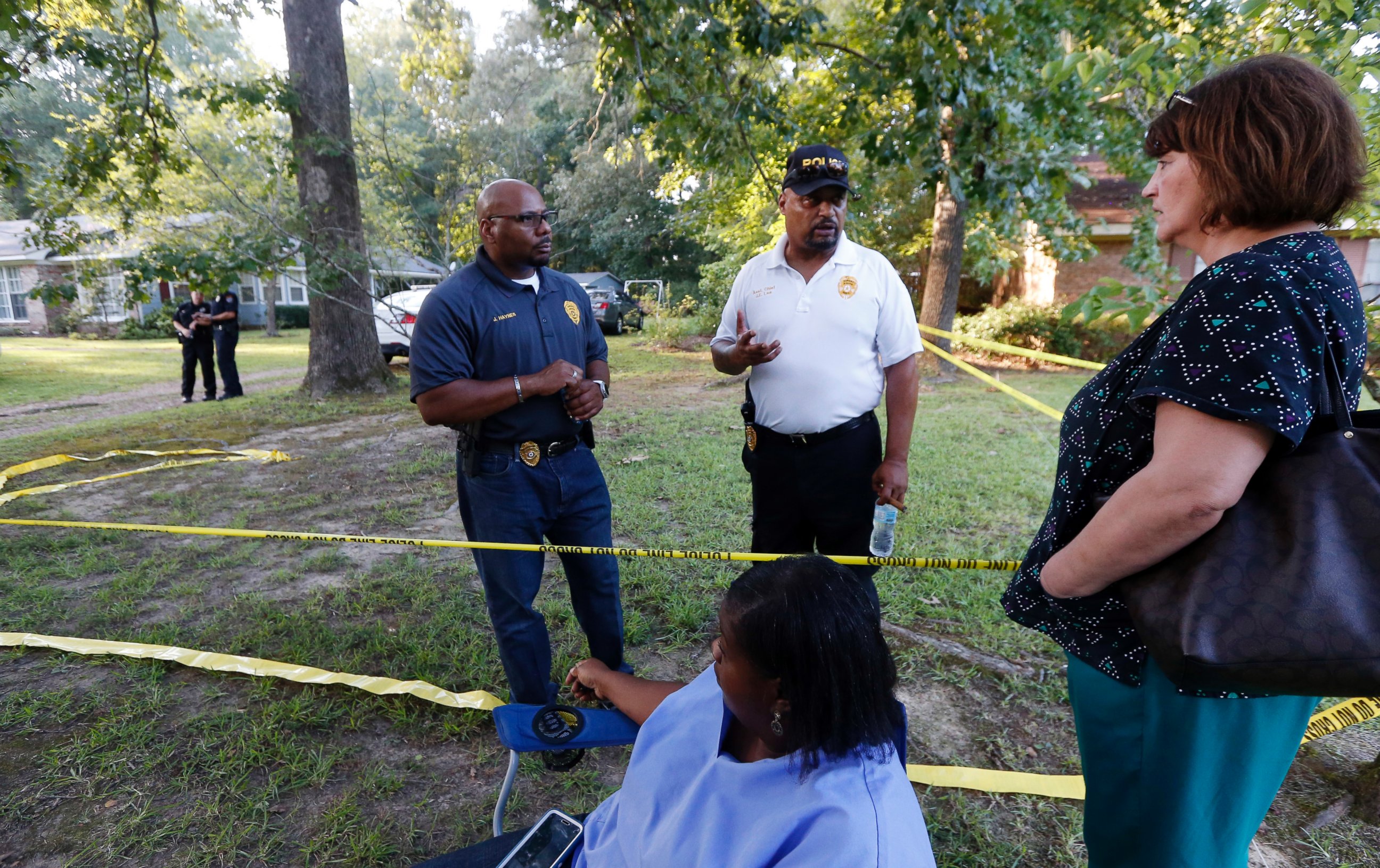 PHOTO: Durant Police Chief John Haynes, left, and assistant Police Chief James Lee reassure Lexington Medical Clinic employees that the home of two slain Catholic nuns was being investigated thoroughly on Aug. 25, 2016, in Durant, Mississippi.