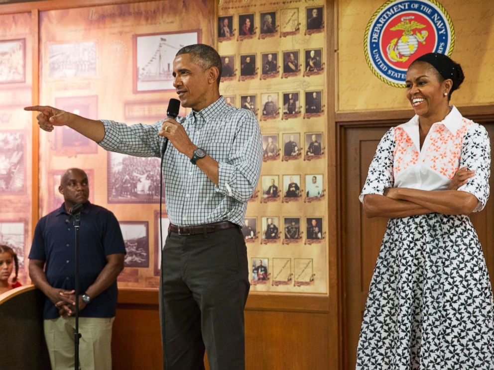 PHOTO: President Barack Obama, with first lady Michelle Obama, points toward a child in the audience as he greets troops and their families on Christmas Day, Dec. 25, 2014, at Marine Corps Base Hawaii in Kaneohe Bay, Hawaii.