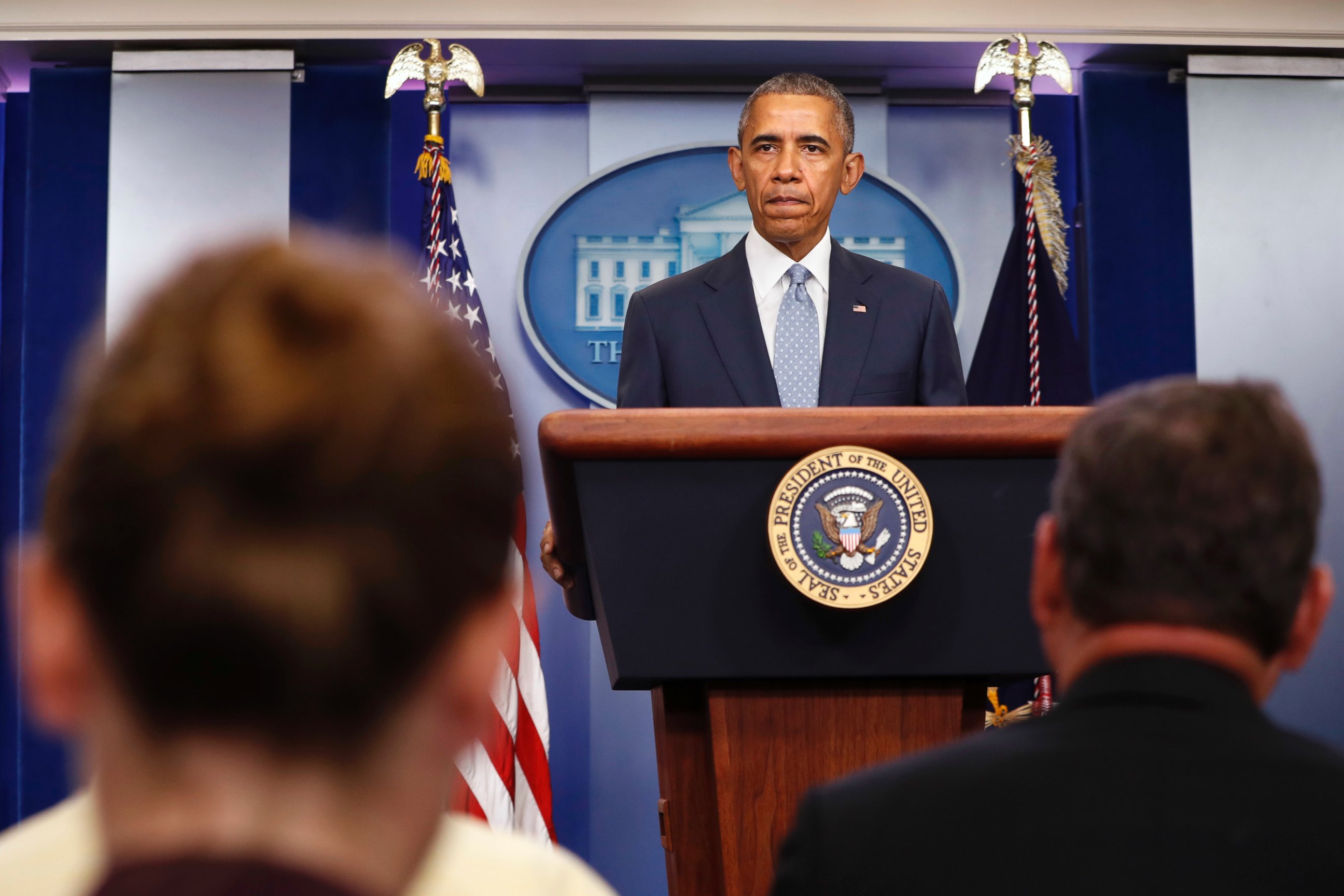 PHOTO: Reporters listen while President Barack Obama speaks about the Baton Rouge, Louisiana, shooting of police officers, July 17, 2016, from the briefing room of the White House in Washington.