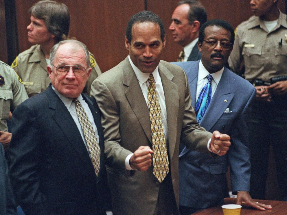 PHOTO: O.J. Simpson, center, reacts as he is found not guilty of murdering his ex-wife Nicole Brown and her friend Ron Goldman in court in Los Angeles, Oct. 3, 1995.