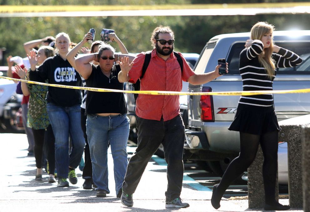 PHOTO: Students, staff and faculty are evacuated from Umpqua Community College in Roseburg, Ore. after a deadly shooting Thursday, Oct. 1, 2015.