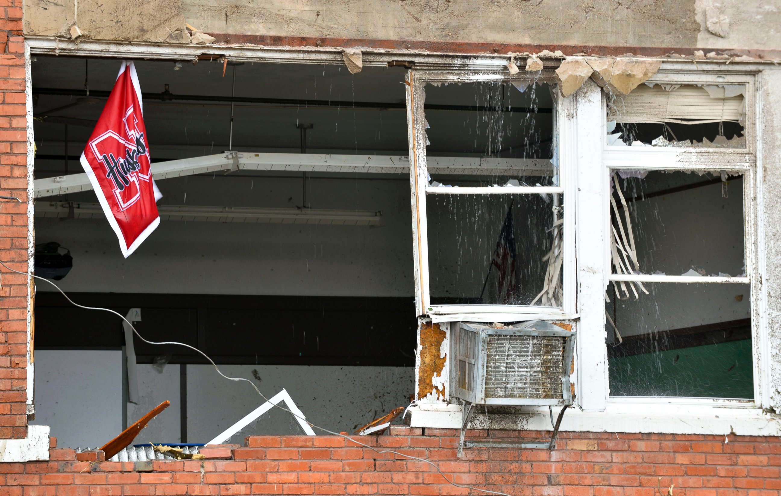 PHOTO: A Husker flag hangs from a window in the heavily damaged school building in Pilger, Neb., June 16, 2014. 