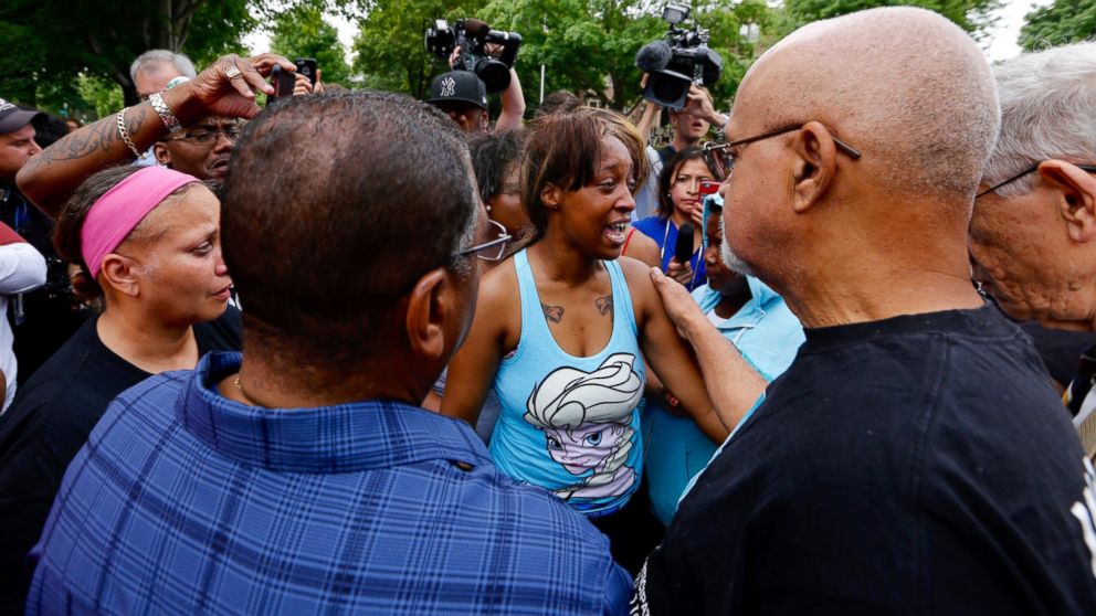 Diamond Reynolds, girlfriend of Philando Castile is consoled after speaking to a crowd outside the governor's residence in St. Paul, Minnesota,  July 7, 2016.
