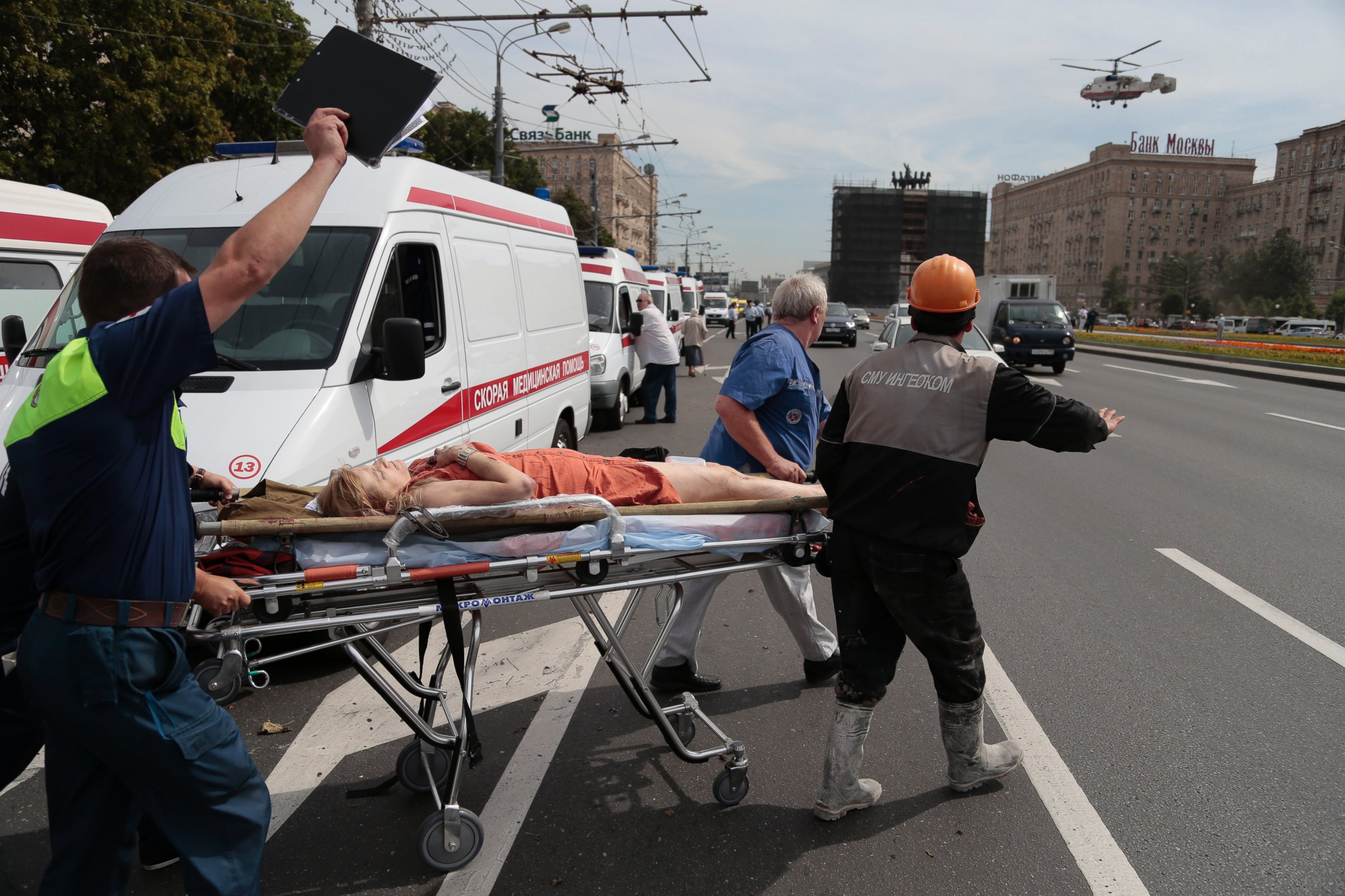 PHOTO: Paramedics carry an injured woman out from a subway station after a rush-hour subway train derailment, to be transported by a medical helicopter in Moscow, Russia, on Tuesday, July 15, 2014.
