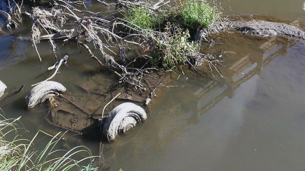 PHOTO: The tires of a Studebaker, missing since 1971, are visible in Brule Creek near Elk Point, S.D. in this undated file photo.