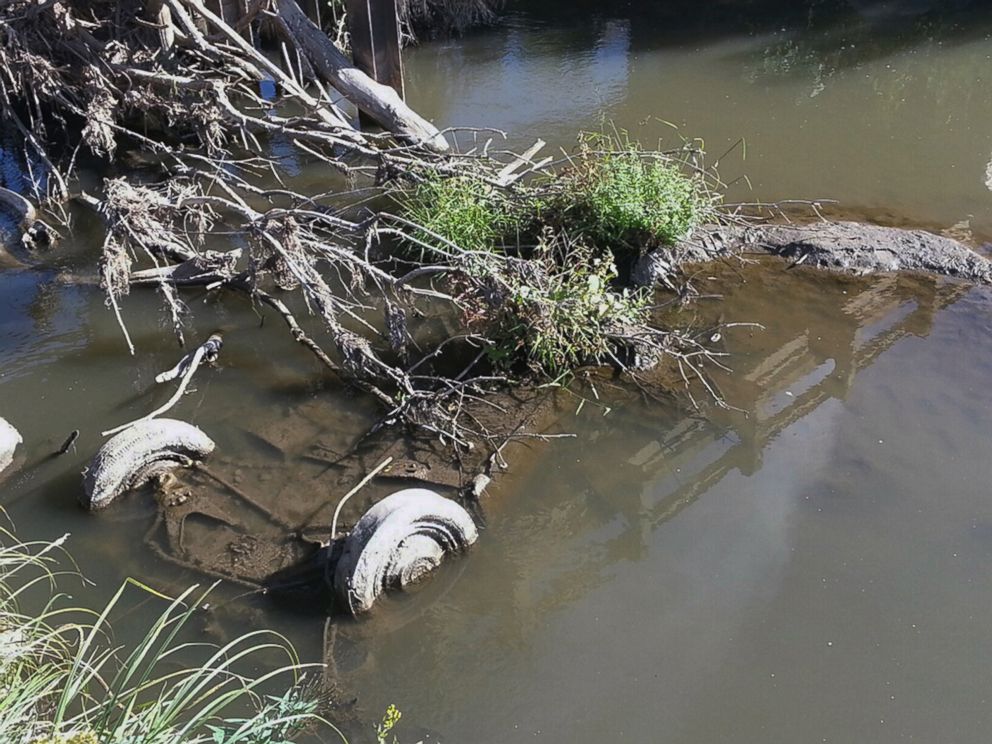 PHOTO: The tires of a Studebaker, missing since 1971, are visible in Brule Creek near Elk Point, S.D. in this undated file photo.