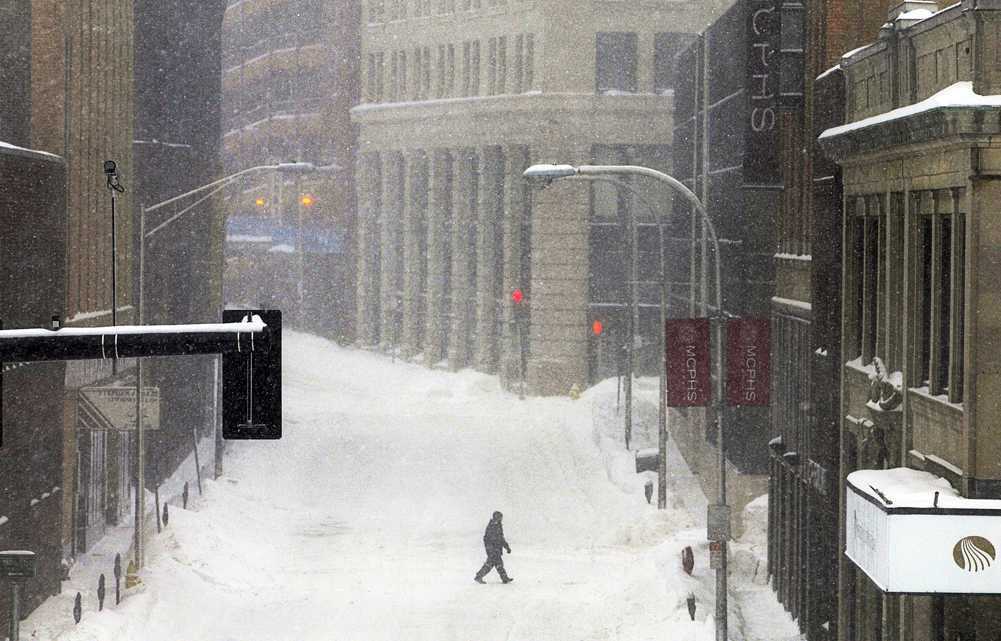 PHOTO: A single pedestrian crosses Mechanic Street during a snowstorm, Feb. 2, 2015, in downtown Worcester, Mass.