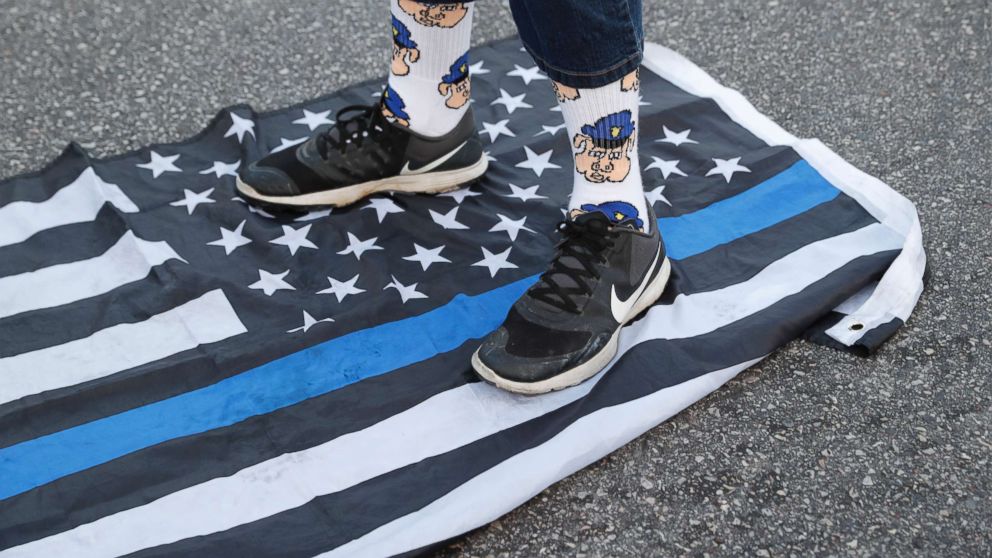 PHOTO: A protester steps on a flag Saturday, Sept. 16, 2017 in University City, Mo., in response to a not guilty verdict in the trial of former St. Louis Police officer Jason Stockley.