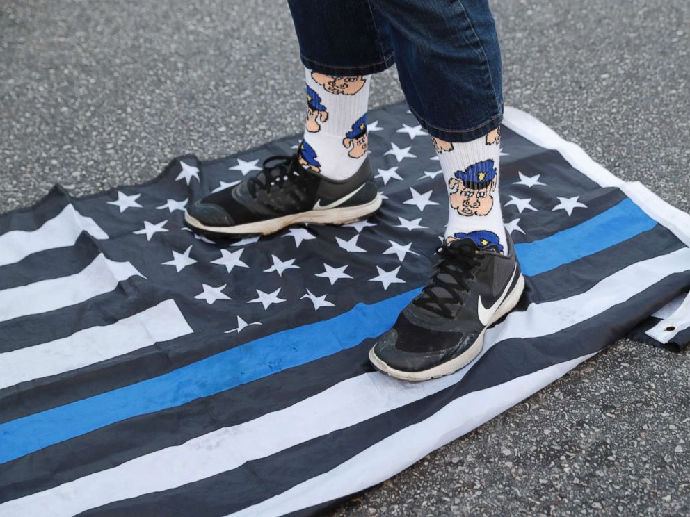 PHOTO: A protester steps on a flag Saturday, Sept. 16, 2017 in University City, Mo., in response to a not guilty verdict in the trial of former St. Louis Police officer Jason Stockley.