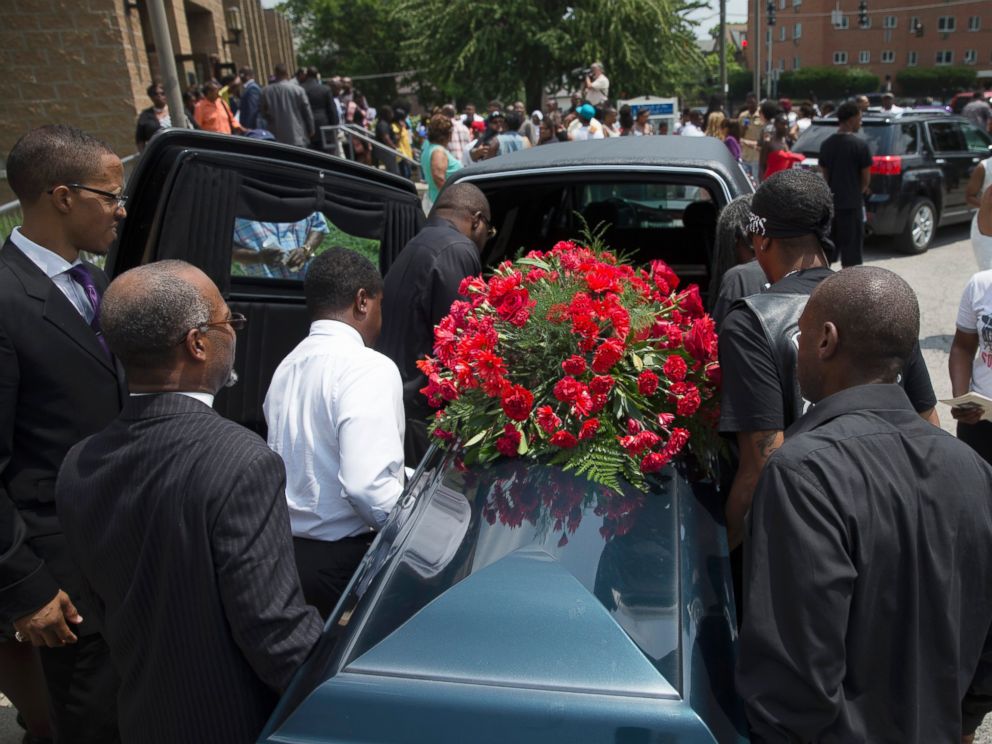 PHOTO: The casket of Samuel Dubose is transported to a hearse during his funeral at the Church of the Living God, July 28, 2015, in the Avondale neighborhood of Cincinnati.