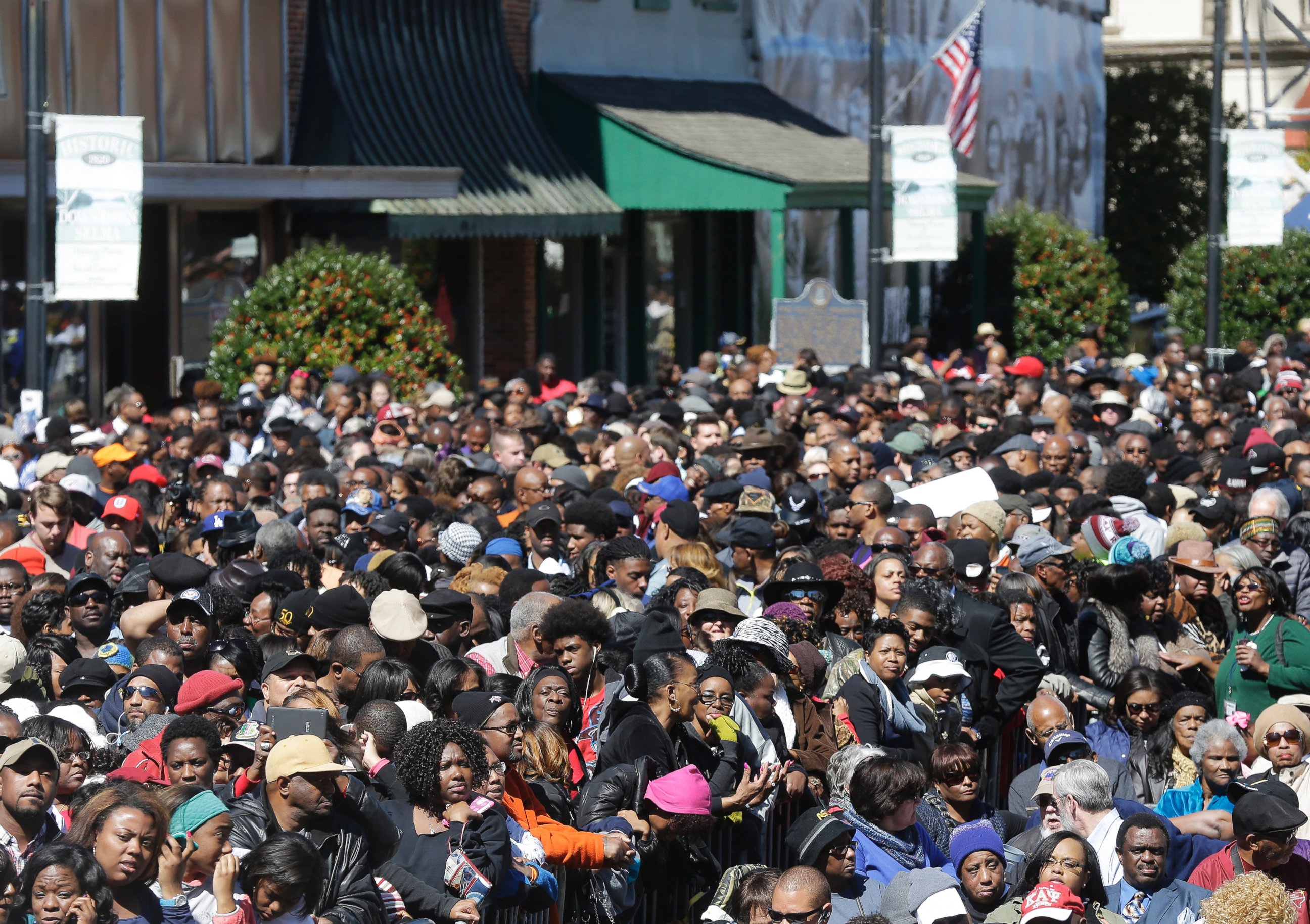 A large crowd forms near a stage where President Barack Obama will speak and then take a symbolic walk across the Edmund Pettus Bridge, Saturday, March 7, 2015, in Selma, Ala. This weekend marks the 50th anniversary of "Bloody Sunday."