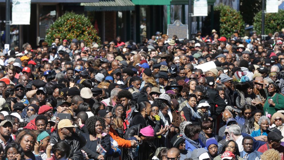 A large crowd forms near a stage where President Barack Obama will speak and then take a symbolic walk across the Edmund Pettus Bridge, Saturday, March 7, 2015, in Selma, Ala. This weekend marks the 50th anniversary of "Bloody Sunday."