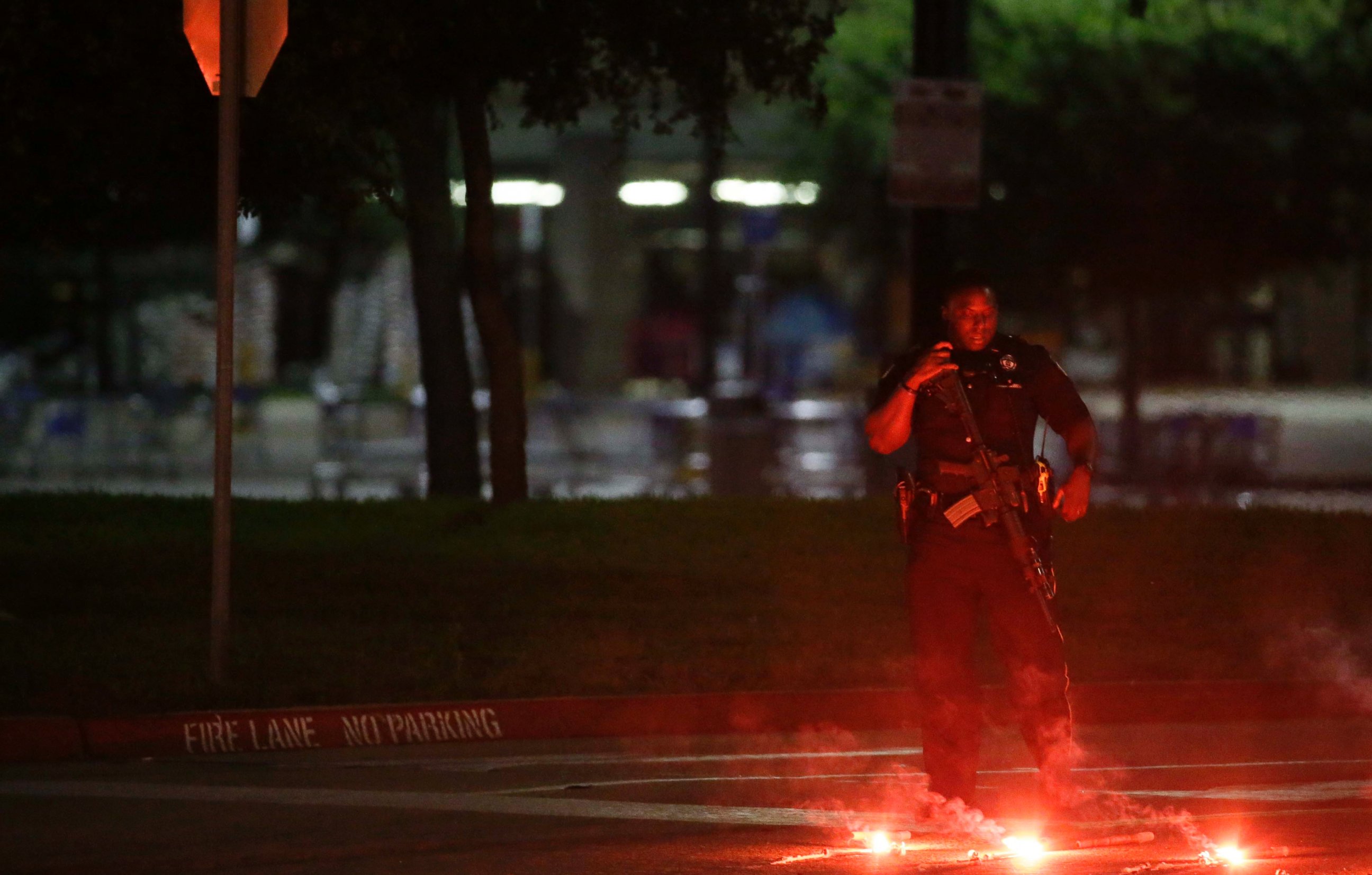 PHOTO: An armed police officer stands guard at a parking lot near the Curtis Culwell Center, May 3, 2015, in Garland, Texas.