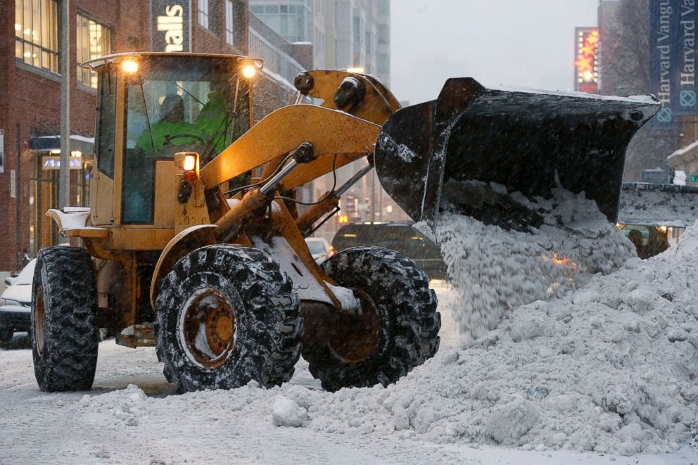 PHOTO: A front end loader clears snow from the street near Fenway Park in Boston, Saturday, Feb. 14, 2015. 