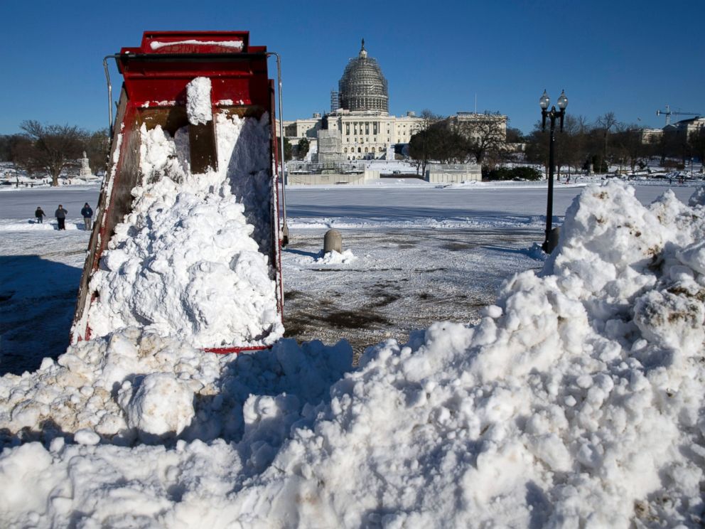 PHOTO:A dump truck empties a load of snow in front of the U.S. Capitol Building in Washington, Jan. 24, 2016.