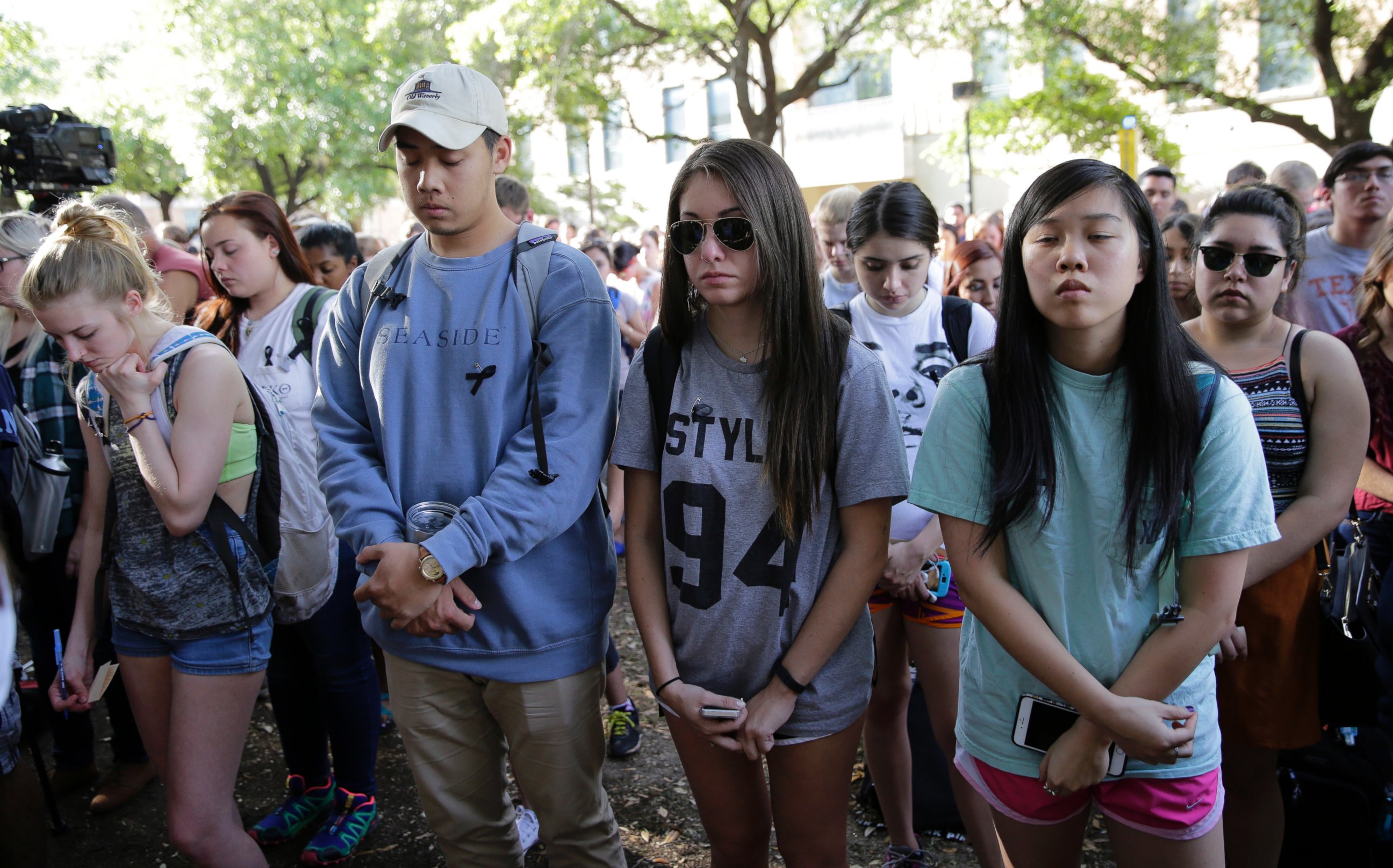 PHOTO: University of Texas students take part in a moment of silence during a gathering for fellow student Haruka Weiser on campus April 7, 2016, in Austin, Texas.