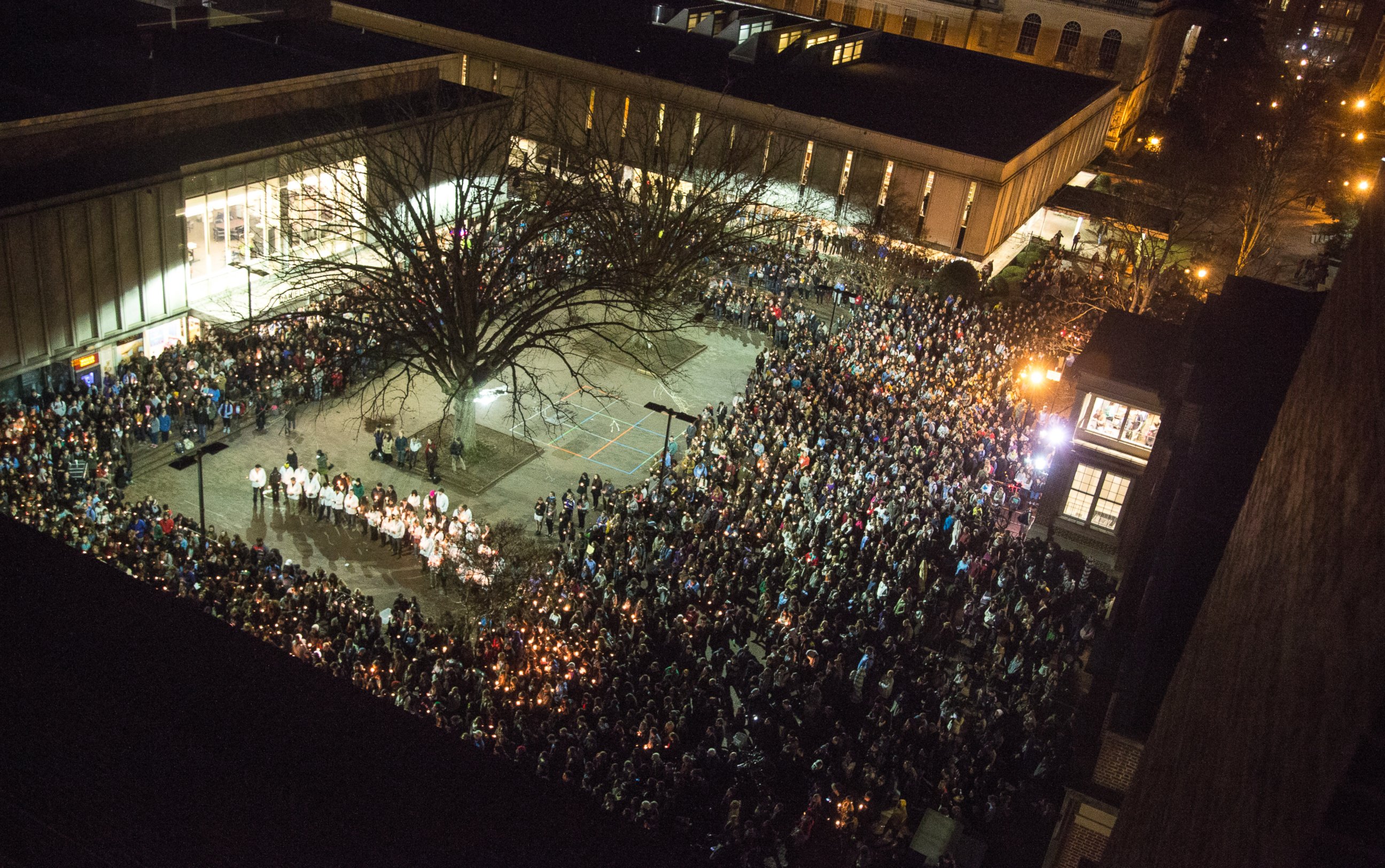 People gather at UNC-Chapel Hill's "Pit" to mourn for Deah Shaddy Barakat, his wife Yusor Mohammed and her sister Razan Mohammed Abu-Salha in Chapel Hill, N.C., Wednesday, Feb. 11, 2015. Craig Stephen Hicks is accused of killing the three on Tuesday.