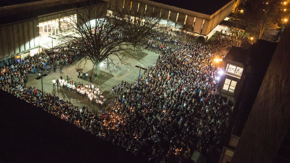 People gather at UNC-Chapel Hill's "Pit" to mourn for Deah Shaddy Barakat, his wife Yusor Mohammed and her sister Razan Mohammed Abu-Salha in Chapel Hill, N.C., Wednesday, Feb. 11, 2015. Craig Stephen Hicks is accused of killing the three on Tuesday.