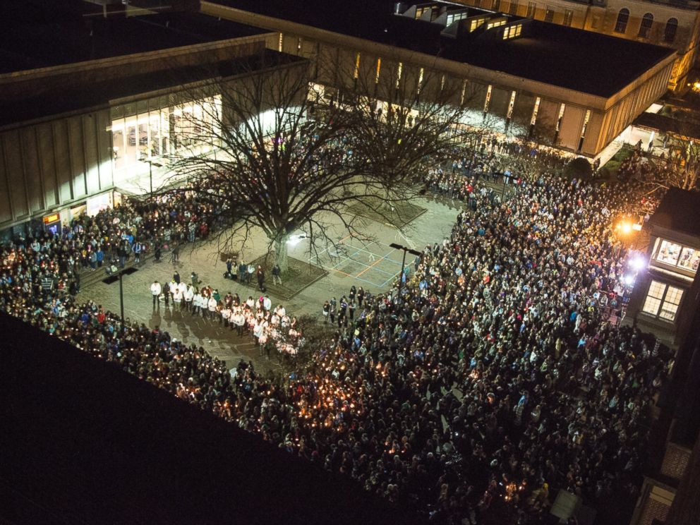 People gather at UNC-Chapel Hills Pit to mourn for Deah Shaddy Barakat, his wife Yusor Mohammed and her sister Razan Mohammed Abu-Salha in Chapel Hill, N.C., Wednesday, Feb. 11, 2015. Craig Stephen Hicks is accused of killing the three on Tuesday.